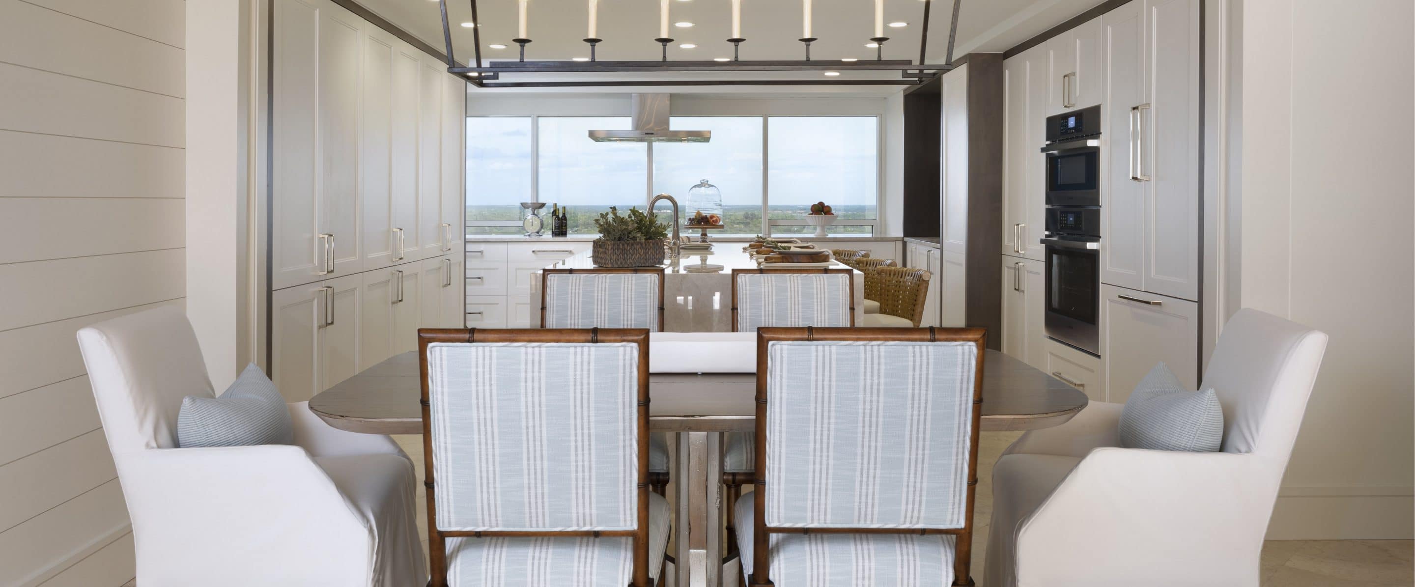 Kitchen and Dining Room with Custom Cabinetry and a Waterfall Vanity